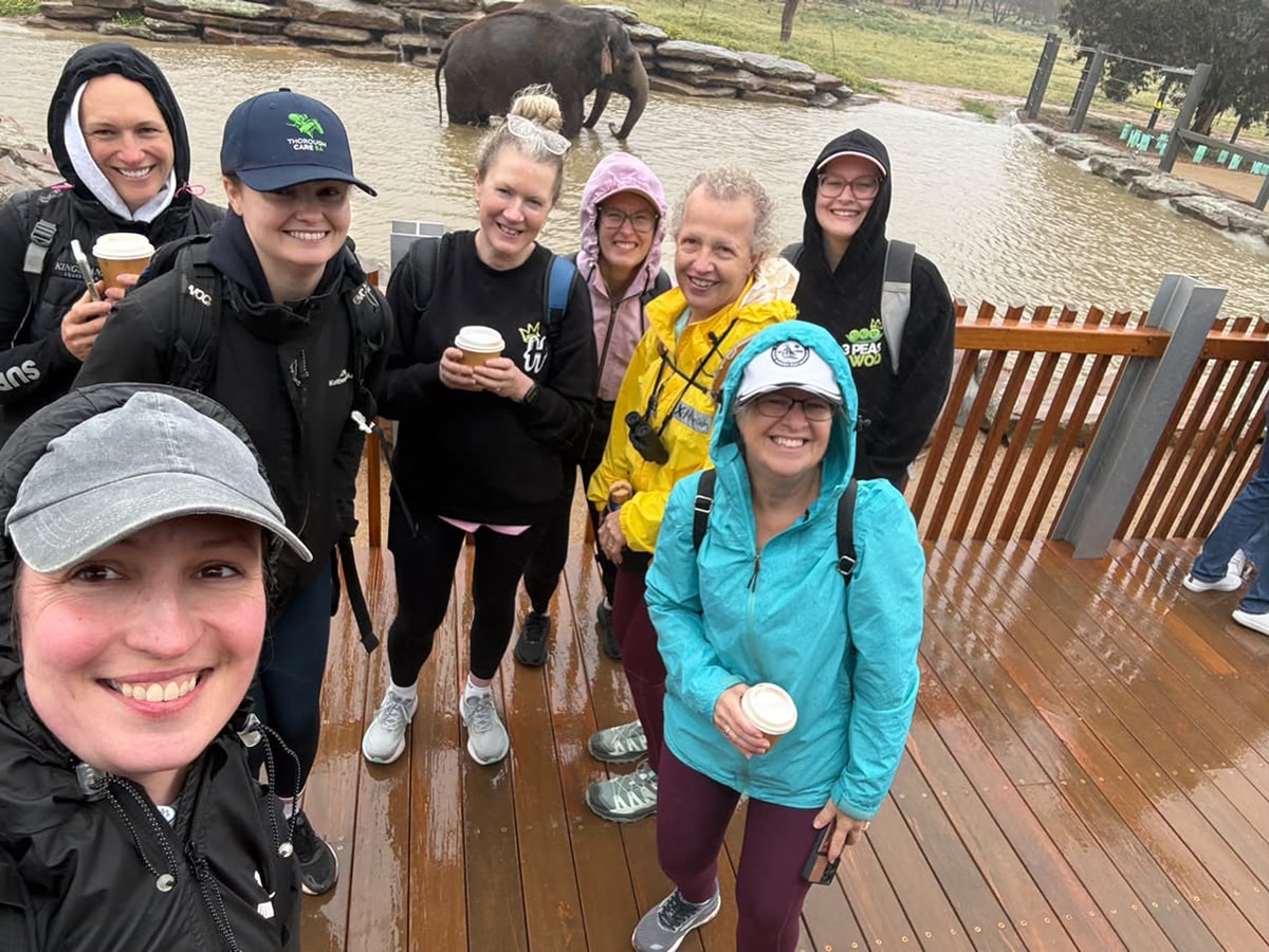 The Monarto crew enjoying a rainy day together beside the elephant enclosure